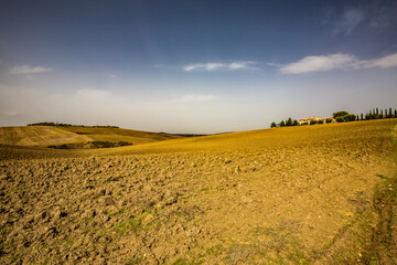 Fototapeta na wymiar Countryside Tuscany, Italy. Daily travel photography, sunny cloudless autumn day.