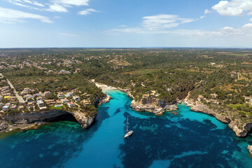 Aerial view of the beautiful beach in Cala Llombards in Mallorca, Spain