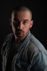 Cool bald bearded handsome man wearing denime jacket