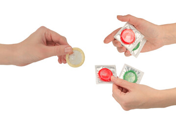 Condom in woman hand isolated on white background.