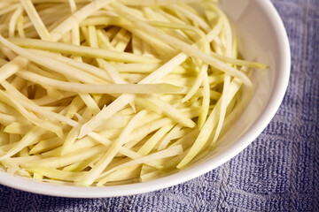 strips of fresh Green papaya for som tum