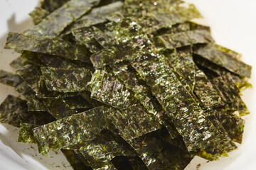 Strips of nori seaweed cut up for garnish © Brian Yarvin