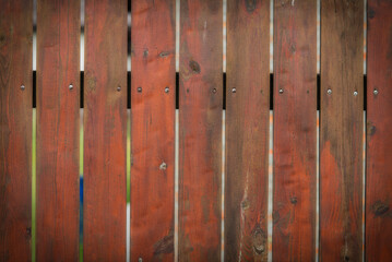 Brown wooden fence.
Texture boards in the form of a rural fence.