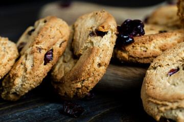 delicious dried cookies made of high-quality flour with dried red cranberries on the table