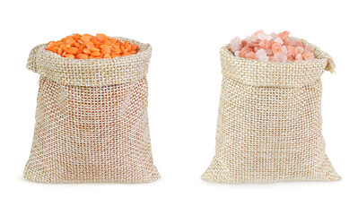 Lentils and Himalayan salt in bags on an isolated white background.