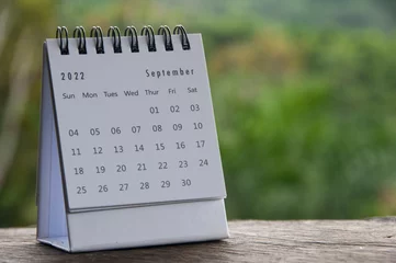Fotobehang September month calendar with blurred nature background. Copy space and new month concept © JeromeMaurice