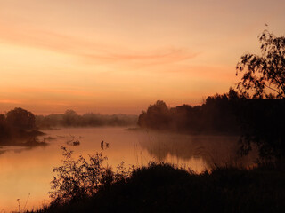 Smoke, fog over the river. Morning on the river. This is how the day begins.