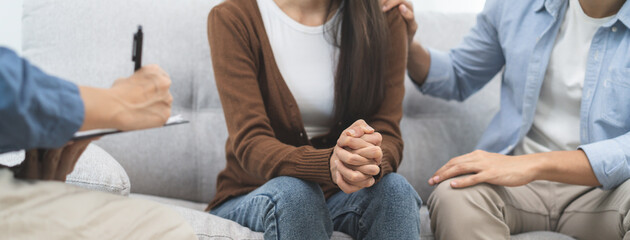 couple relationship therapy with a counselor. Close Up hands of the woman client during a...