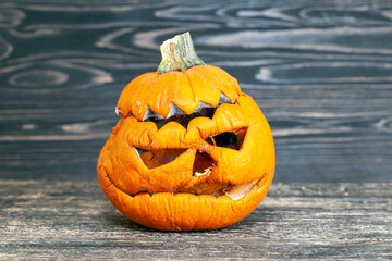 carved from pumpkin frightening face in mold and mildew during decomposition