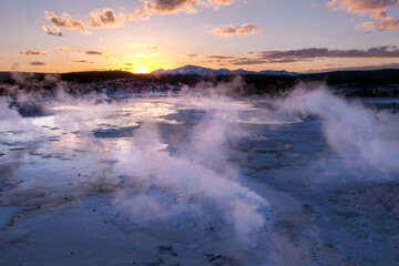 Sunset golden hour in Norris Geyser Basin area, Yellowstone National Park, Wyoming, USA. Volcanic landscape with geothermal activity.