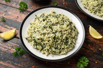 Spanakorizo, greek spinach rice. Healthy vegetarian food. - obrazy, fototapety, plakaty