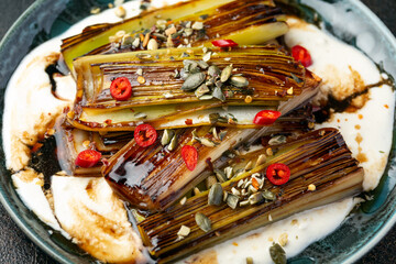 Sweet and sour braised leeks over whipped feta cheese, vegetarian vegan summer Asian style food...