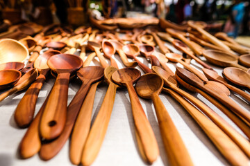 Craftsman made wooden spoons at the fair, selective focus