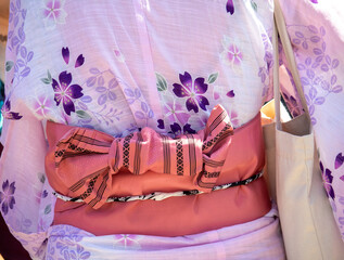 Detail of the bow of a pink japanese kimono