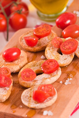 Friselle with cherry tomatoes and olive oil.