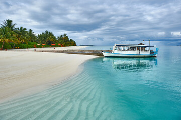 Maldives. Tropical beach. Travel and tourism to luxury resorts in the Maldives islands. Summer holiday concept