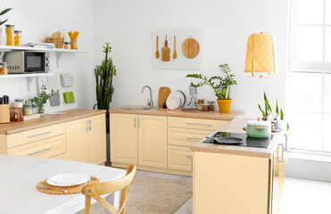 Light kitchen with modern furniture and pegboards