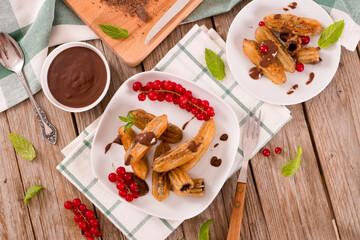 Mini churros with chocolate dipping sauce.