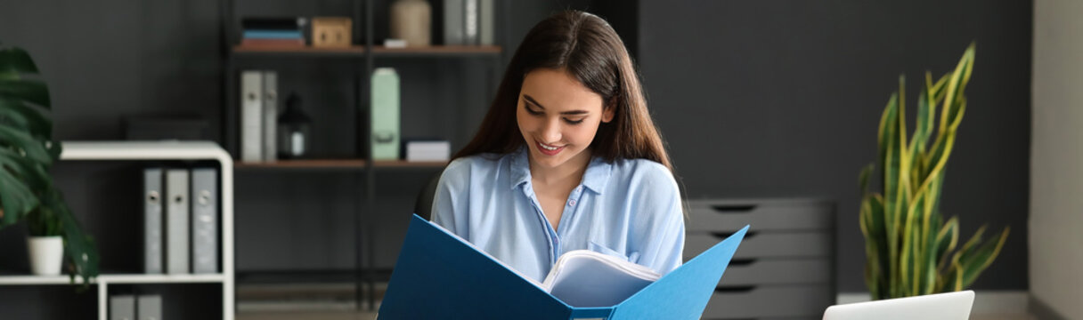 Young Businesswoman Working With Documents In Office