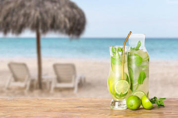 Glassware of fresh mojito on table at tropical resort