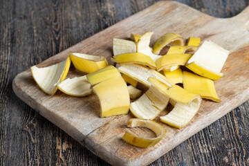 the yellow peel that was left after the bananas on the board