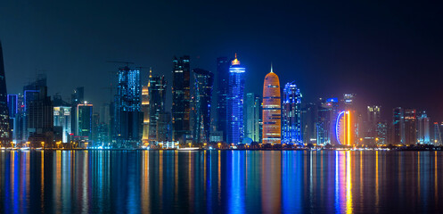 Doha skyline with many towers during the night.