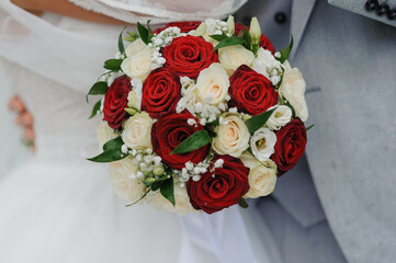 Bouquet of flowers in the hand of the bride