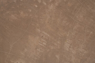 Brown concrete texture. Stone wall background. Surface of the concrete old floor in scratches, which you can use as overlay in your design. High quality photo