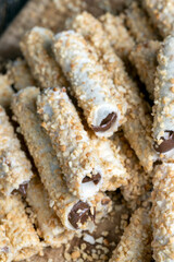 waffle tube with chocolate filling and crushed peanuts