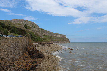 Fototapeta na wymiar A landscape shot of the Great Orme as seen from the Promenade at Llandudno in North Wales. This photo was taken during the Bank Holiday weekend.