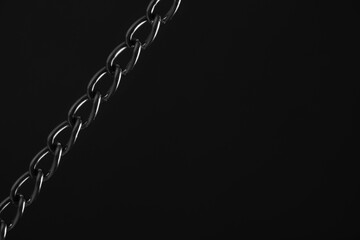 Nickel plated metal chain black background.