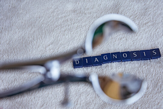 rectoscope with the words diagnosis on a white blanket