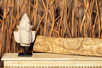 Gypsum figurine of the head of a sphinx in a vintage interior.