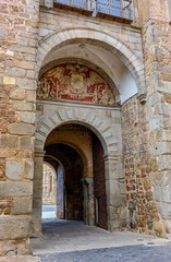 Fototapeta na wymiar New Bisagra gate, crowned by the coat of arms of the city, the characteristic of the Emperor Carlos V. Toledo, Castilla La Mancha, Spain.