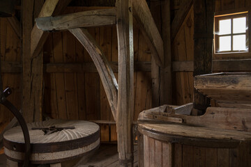 an old wood mill from the inside - obrazy, fototapety, plakaty