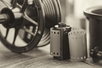 Photo film roll and cassette, photographic equipment - developing tank with its film reels on...