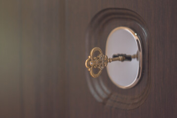 Antique vintage key in the keyhole. Vintage key close-up.