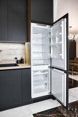 Contemporary fridge with open doors in apartment studio