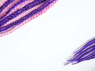 Fototapeta premium Purple and pink kanekolon afro braids, space for text