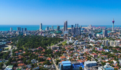 Background View of the Colombo city skyline with modern architecture buildings including the lotus...