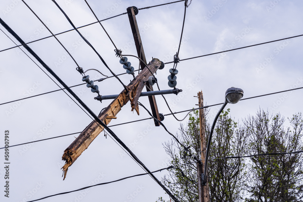 Wall mural unbelievable damage electricity supply lines after hurricane strength winds snap utility poles and o