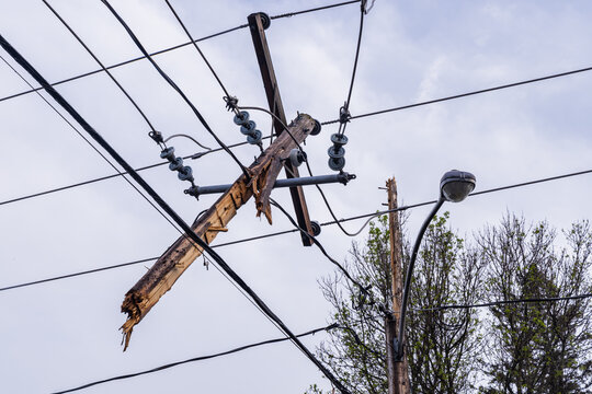 Unbelievable damage electricity supply lines after hurricane strength winds snap utility poles and overhead wires, causing widespread disruption.
