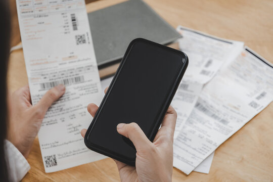 Woman Hand Entering Password Code On Mobile Phone Paying Bill With Credit Card Bill On Desk In Home Office, Internet, Digital Marketing, Mobile Banking, Online Payment And Digital Technology Concept