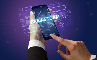 Hand using smartphone with social media concept