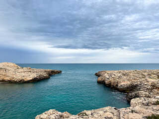 Small rocky Paura beach in the center of Polignano a Mare in the Apulia region in southern Italy