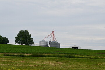 Fototapeta premium Grain Bins in a Farm Field