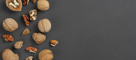 walnuts on a matte black background close-up, copy space, top view