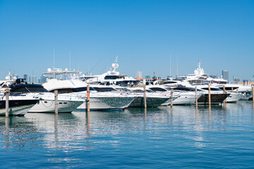 Sea water reflecting sunlight at luxury motor yachts in South Beach, USA