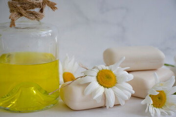 natural soap, chamomile flower on a light background