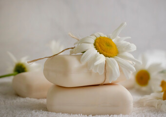 natural soap, chamomile flower on a light background